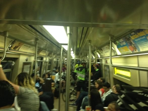 Mucking it on the A train heading to 168th street station with those heading home from a night out and a few steadfast cyclists. (may 18, 2014)